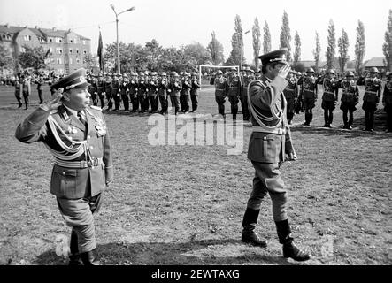 15 March 1982, Saxony, Delitzsch: Marching past superiors and parade. Young soldiers of the NVA are sworn in on a sports field in Delitzsch in spring 1982. Parents, relatives, acquaintances and the population take part. Exact date of recording not known. Photo: Volkmar Heinz/dpa-Zentralbild/ZB Stock Photo