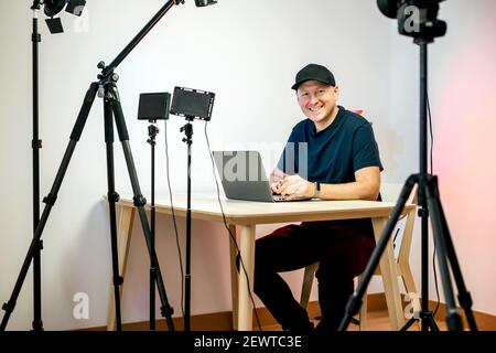 Famous internet influencer filming agenda review while at home in studio.  Popular social media star doing notebook recommendation video while  presenting product to audience Stock Photo - Alamy