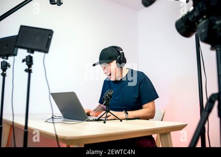 Gamer, streamer, or Youtuber streaming and recording in his home studio Stock Photo