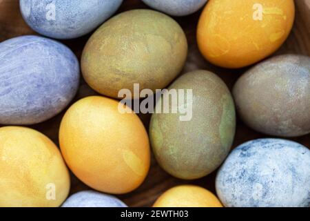 Easter eggs painted with natural dyes. Top view, close up. Stock Photo