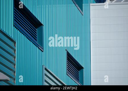 Public building white concrete and turquoise cladding side wall in downtown San Diego, California USA. Stock Photo