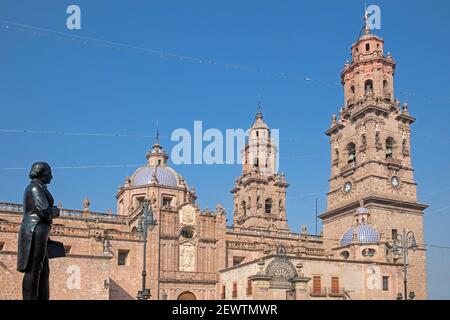 18th century Baroque Cathedral of Morelia / Catedral de Morelia and statue of José Maria Morelos in the city Morelia, Michoacán, Mexico Stock Photo