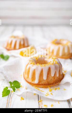 Tangy mini lemon bundt cakes topped with lemon glaze Stock Photo