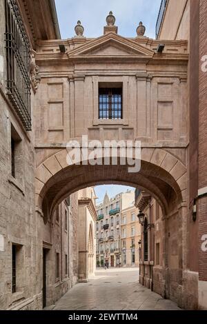 Arch on Barchilla Street linking the cathedral with the Archbishopric of Valencia city, Spain, Europe Stock Photo