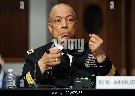 Washington, United States. 03rd Mar, 2021. Army Maj. Gen. William Walker, Commanding General of the District of Columbia National Guard answers questions during a Senate Homeland Security and Governmental Affairs/Rules and Administration hearing to examine the January 6, 2021 attack on the US Capitol on Wednesday, March 3, 2021 in Washington, DC. Pool Photo by Greg Nash/UPI Credit: UPI/Alamy Live News Stock Photo