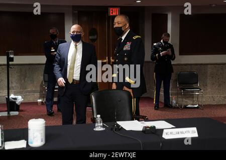 Washington, United States. 03rd Mar, 2021. Robert Salesses, Senior Official Performing the Duties of the Assistant Secretary for Homeland Defense and Global Security, Department of Defense talks to Army Maj. Gen. William Walker, Commanding General of the District of Columbia National Guard during a break at a Senate Homeland Security and Governmental Affairs/Rules and Administration hearing to examine the January 6, 2021 attack on the US Capitol on Wednesday, March 3, 2021 in Washington, DC. Pool Photo by Shawn Thew/UPI Credit: UPI/Alamy Live News Stock Photo