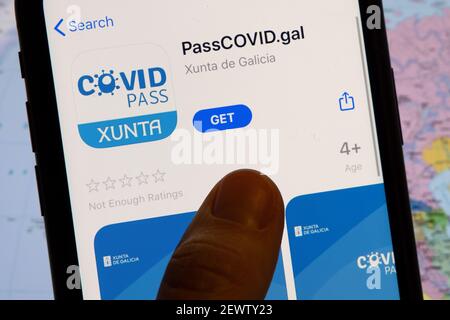 Vaccination, disease immunity passport, health and surveillance concepts. Smartphone displaying a valid digital vaccination certificate for COVID-19 Stock Photo