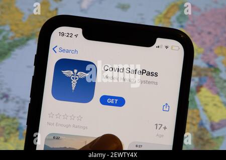 Vaccination, disease immunity passport, health and surveillance concepts. Smartphone displaying a valid digital vaccination certificate for COVID-19 Stock Photo