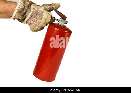 Workers hand holding an old fire extinguisher isolated on white background. Stock Photo