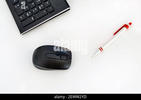 Computer mouse and graphic pen, top view. Selective focus. Stock Photo