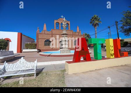 Fountain, monumental colored letters and Temple of San Francisco de Asís in Atil, Sonora Mexico. Atil small town in the northwest of the Mexican state of Sonora. The neighboring municipalities are Tubutama, Trincheras, Oquitoa and Altar. It was founded in 1751 Jesuit missionary Jacobo Sedelmayer. The first inhabitants were the Pima Alto or Nebome Indians. Atil means 'Arrowhead', in the Pima language.  (Photo by Luis Gutierrez / Norte Photo)  Fuente, letras monumentales de colores y Templo de San Francisco de Asís en Atil, Sonora Mexico. Átil pequeño pueblo en el noroeste del estado mexicano de Stock Photo