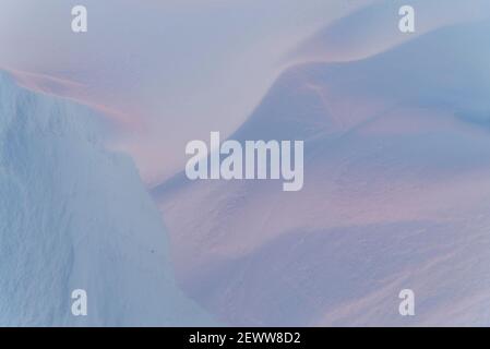 Subtle light and abstract patterns in snow Stock Photo