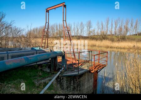 A large sickle station built on the river to pump water into irrigation canals. The pumping station is used by agriculture in the dry season to irriga Stock Photo