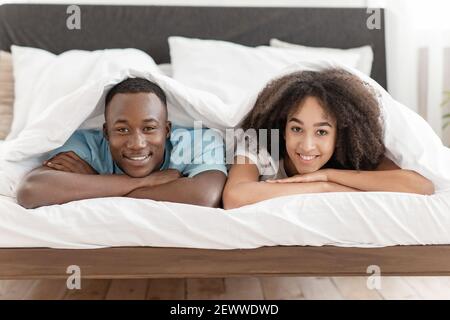 Pleasure at home, rest at flat, comfortable bed and love in new apartment Stock Photo