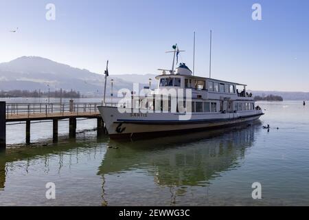 rapperswil jona, sankt gallen, switzerland - february 20, 2021: at the pier, säntis ship, landing stage, people waiting to get off the ship Stock Photo