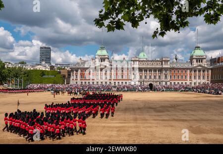 Guardsmen and women marching during Trooping the Colour annual military parade marking Queen Elizabeth's official birthday, London UK Stock Photo