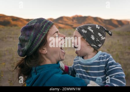 Mother and daughter having fun in the desert Stock Photo