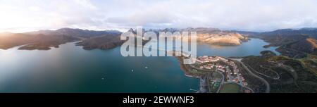 sunrise in high mountain reservoir from aerial view in panoramic Stock Photo