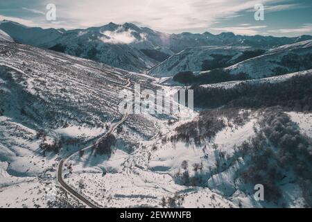 sunrise in high mountain road from aerial view Stock Photo