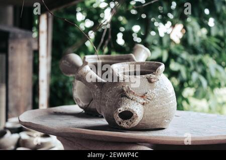 Close-up of broken craft product on pottery wheel at workshop Stock Photo