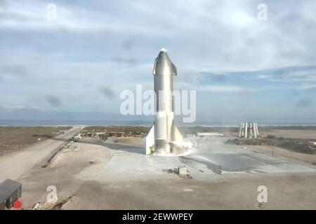 Boca Chica, United States. 03rd Mar, 2021. SpaceX completed the first upright landing of the company's deep-space Starship rocket, SN-10, after a test flight on March 3, 2021, in Boca Chica, Texas. Minutes later, the test vehicle exploded after a fire broke out at the base of the rocket. SpaceX/UPI Credit: UPI/Alamy Live News Stock Photo