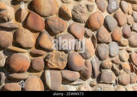 Horizontal wall of stones set in concrete, useful image for copy space Stock Photo