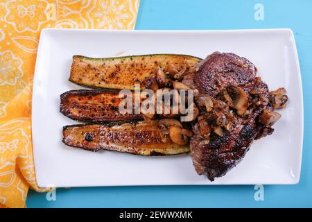 grilled organic beef steak with fried zucchini Stock Photo