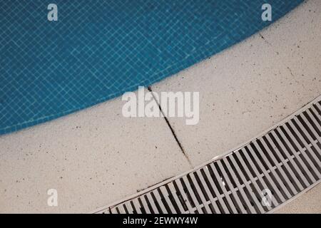Top view of a swimming pool floor with blue tiled. Textured background Stock Photo