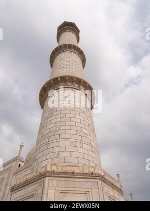 AGRA, INDIA - MARCH, 26, 2019: a close up low angle shot of a marble minaret of the taj mahal Stock Photo