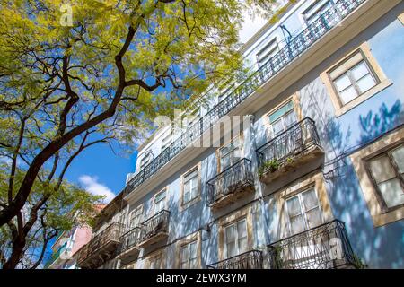 Colorful buildings of Lisbon historic center near landmark Rossio Square. Stock Photo