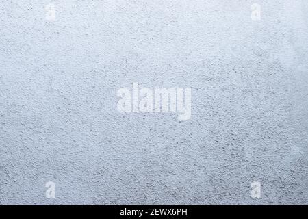 White cement texture stone concrete,rock plastered stucco wall. painted flat fade pastel background white grey solid floor grain. Structural plaster Stock Photo