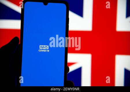silhouette of person using NHS Covid-19 UK mobile application in samsung mobile Stock Photo