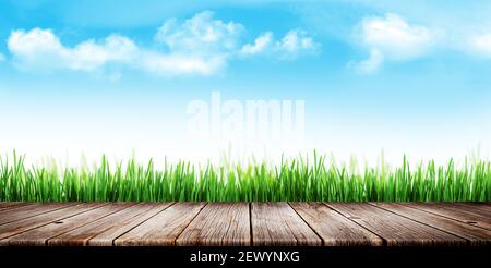Wooden table top in front of grass meadow and blue sky. With space for your  product Stock Photo - Alamy
