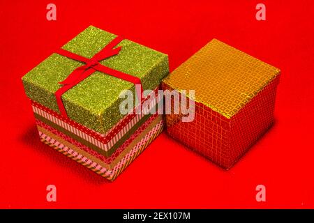 Two Christmas Gift Boxes On Red Background Stock Photo
