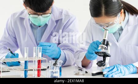 Team of Medical Research Scientists or researcher in lab coat testing their experimental in Modern laboratory Stock Photo