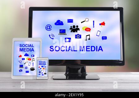 Social media concept shown on different information technology devices Stock Photo