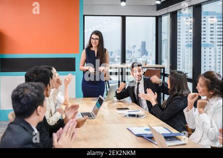 Multiethnic business meeting corporate of colleagues and executive with happy and enjoying in modern office Stock Photo