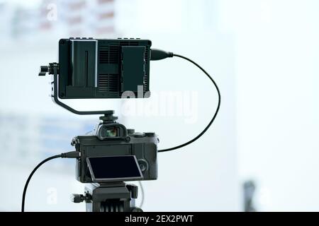 Dslr camera with additional screen for video shooting . Stock Photo