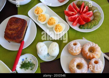 Polish Easter Sunday breakfast. Typical easter foods in Poland: eggs, babka cakes and Easter pate. Stock Photo