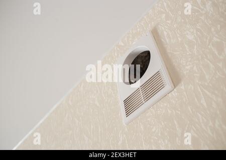 Ventilation system hole in the room. Installing the wall fan vent. Restoration process. Maintenance repair works renovation in the flat. Stock Photo