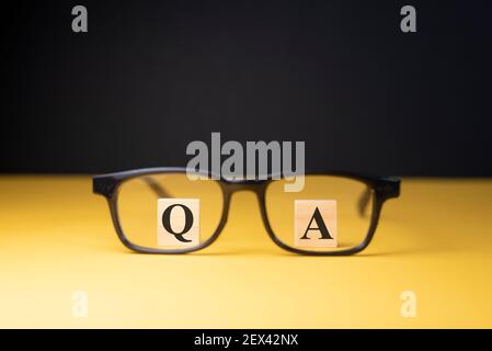 Q and A alphabet through an eyeglass. Concept of questions and answers Stock Photo