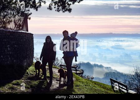 A young couple with their child on the Cotswold Escarpment near Wotton-under-Edge in Gloucestershire Stock Photo