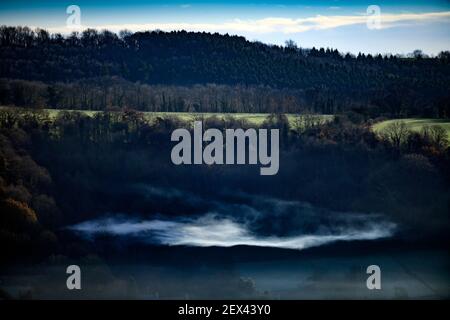 Misty views from the Cotswold Escarpment near Wotton-under-Edge in Gloucestershire UK Stock Photo
