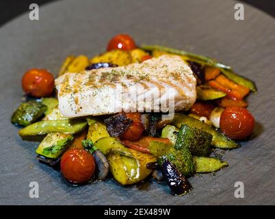 roasted cod fillet on mediterranean vegetables Stock Photo