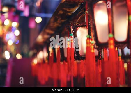 Selective focus on traditional red Chinese lanterns with blessings. Man Mo Temple, Hong Kong Stock Photo