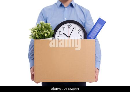 Close up of male hands holding box with working stuff including plant and documents isolated on white background Stock Photo