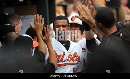 Baltimore Orioles Adam Jones, Manny Machado, the batboy and Chris Davis all  watch the Rangers game against the Boston Red Sox at Camden Yards in  Baltimore, Maryland, Sunday, September 30, 2012. The