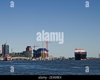 Cargo Ship Leaving the Port of Hamburg, Germany Stock Photo