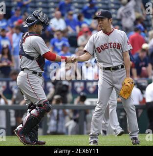 Boston Red Sox closing pitcher Koji Uehara (19) celebrates with catcher  Jarrod Saltalamacchia, right, after the Red Sox beat the Seattle Mariners  11-8 in a baseball game, Tuesday, July 9, 2013, in