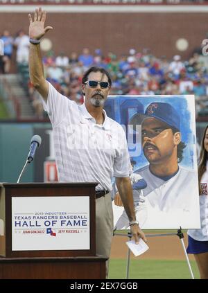 Hall of Fame president Jeff Idelson, left, presents National Baseball Hall  of Fame inductee Jeff Bagwell with his Hall of Fame plaque during an  induction ceremony at the Clark Sports Center, Sunday